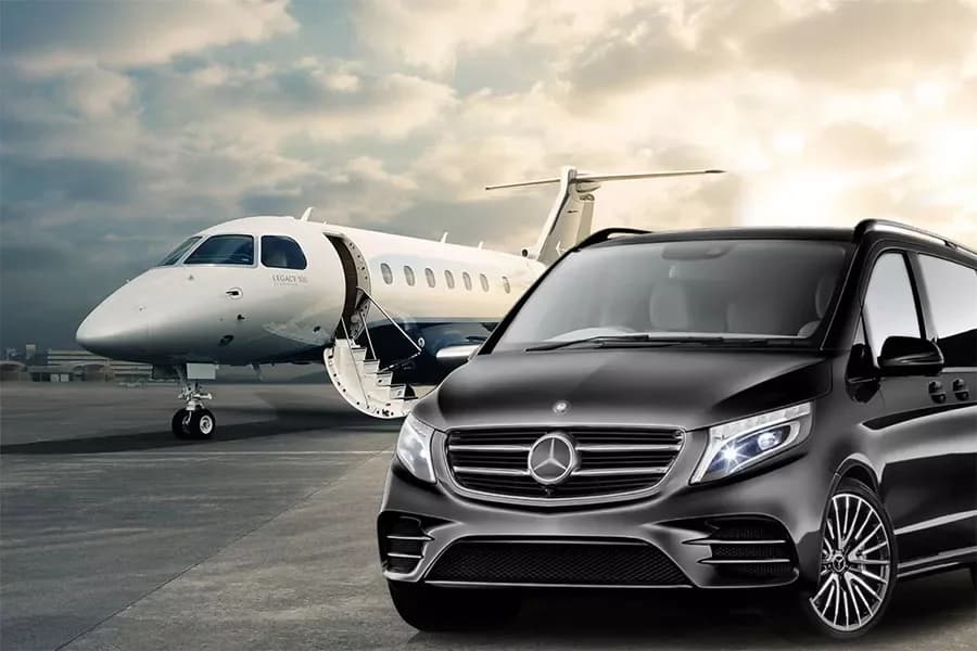 Private airport transfer van waiting on the tarmac after landing